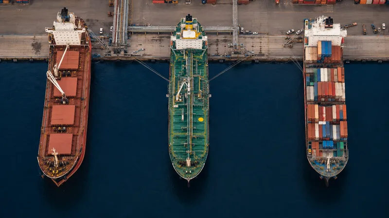 Three commercial vessels at separate deepwater port berths