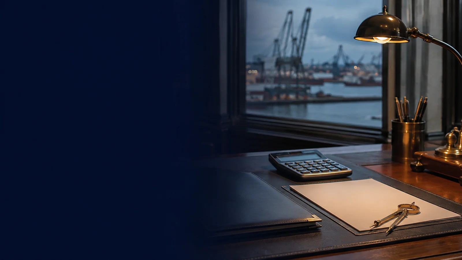 Calculator and vessel paperwork on a desk overlooking a shipping harbor